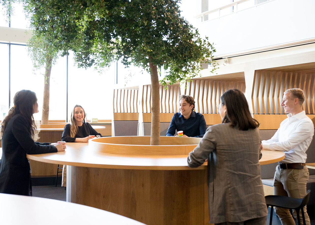 Colleagues talking in a common area