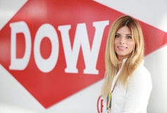 Women in front of Dow logo
