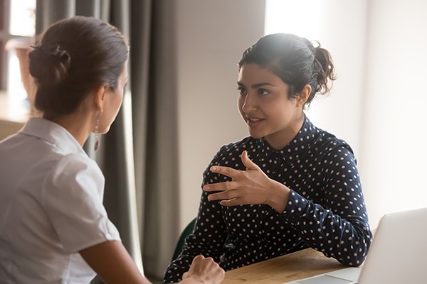 two colleagues having a personal conversation