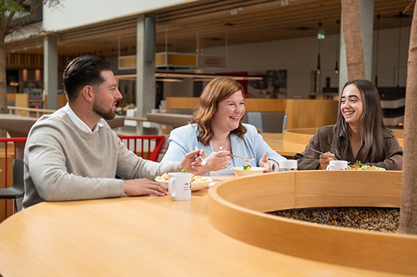 four colleagues take a break to talk