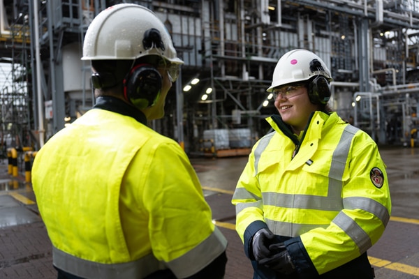 two workers on processing floor