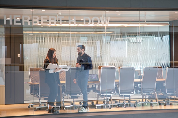 two colleagues in a meeting room