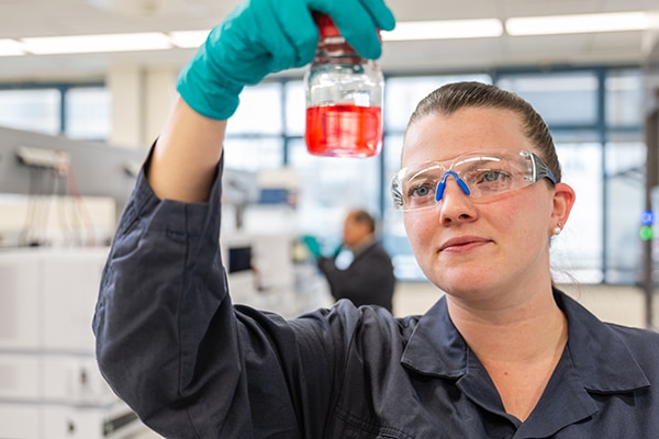 Dow scientist inspects a material in a lab